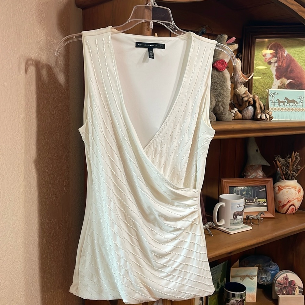 Cleaning out my closet!!! Cream colored sleeveless top with Brad accent, lined.